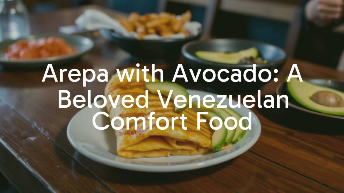 Golden fried arepa topped with fresh avocado slices, rustic wooden table, warm lighting, traditional Venezuelan food.