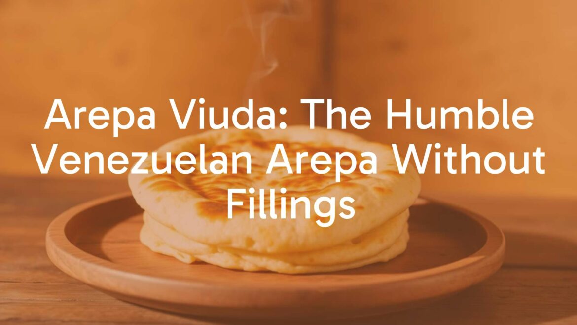 A freshly baked Venezuelan arepa viuda on a wooden plate, golden brown crust, steam rising, minimalist presentation, warm lighting, rustic background.